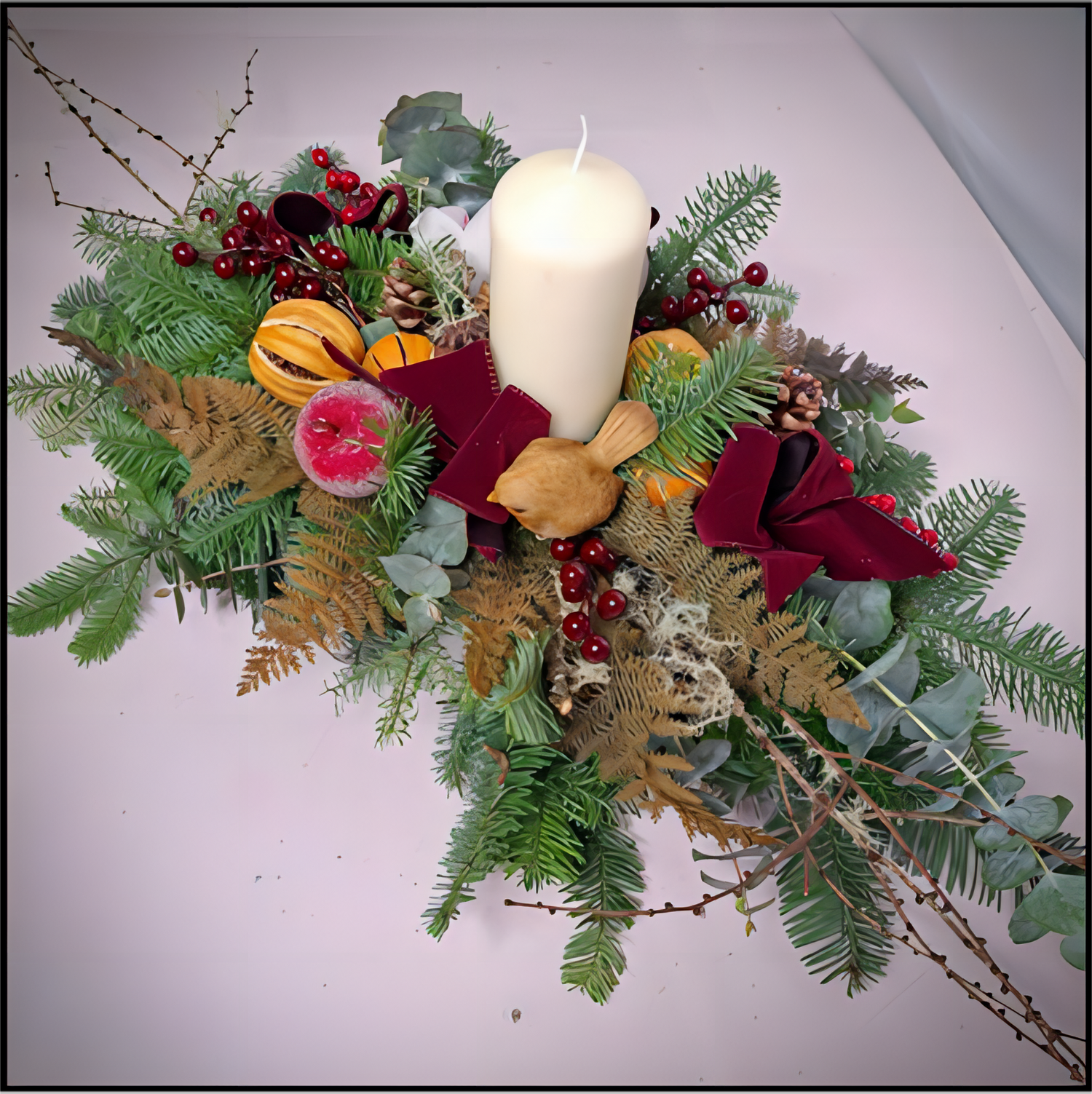 Oval delight fresh oval table centre and thick candle with all the scents of Christmas hand made at Eleanor's Florist