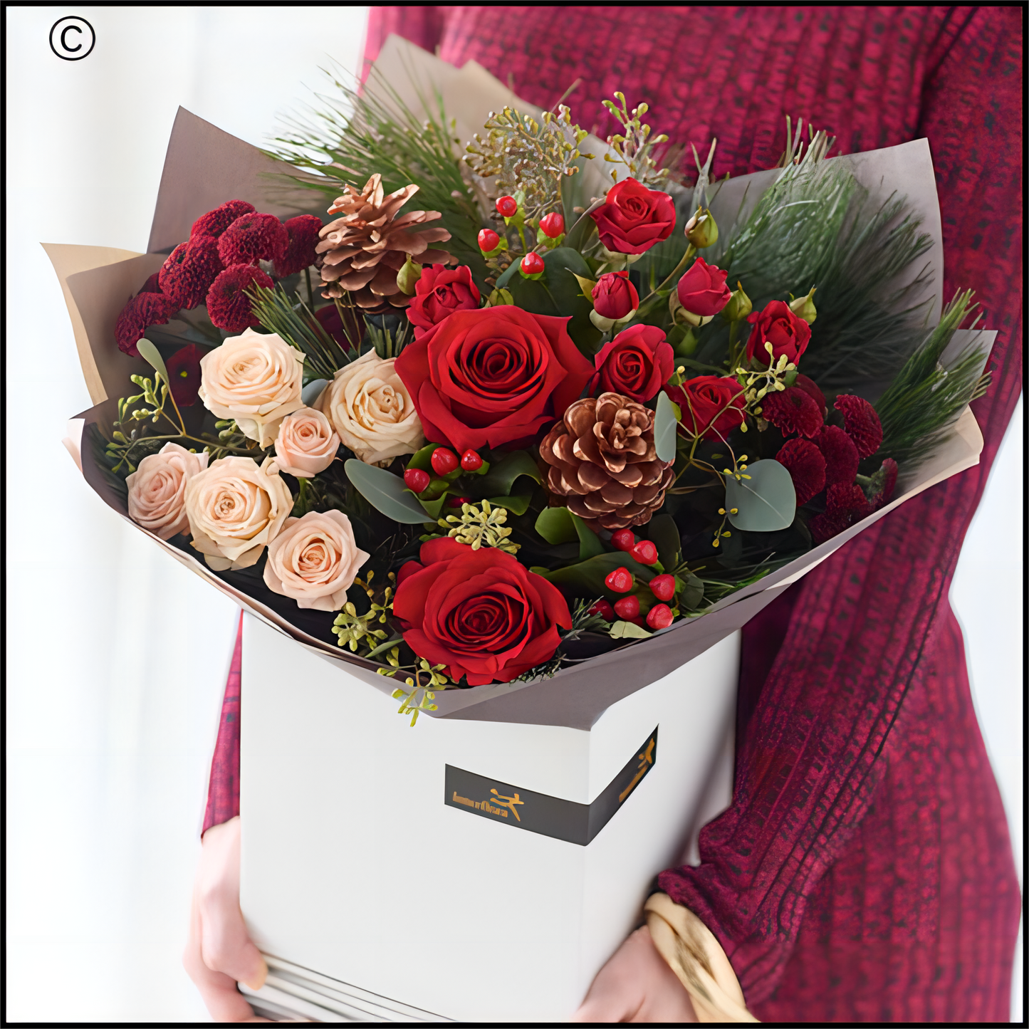 a stunning bouquet of fresh, Christmassy flowers, arranged with love and care by Eleanor's Florist

Colour & style: festive favourites. Rich reds, burgundies and greens. Pops of cream and peach. You might see coppery painted pinecones, scented dried fruit, spruce and pine.
